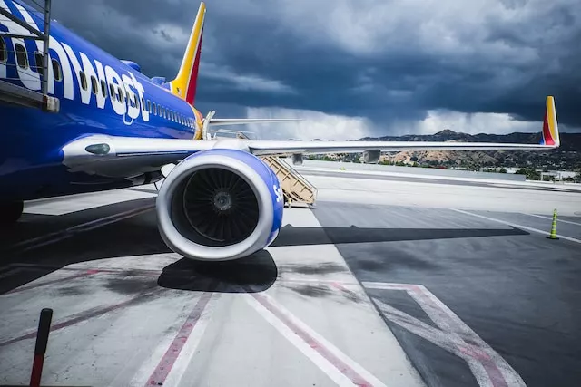 Close-up of one of the engines on a Southwest Airlines plane sitting at the airport.